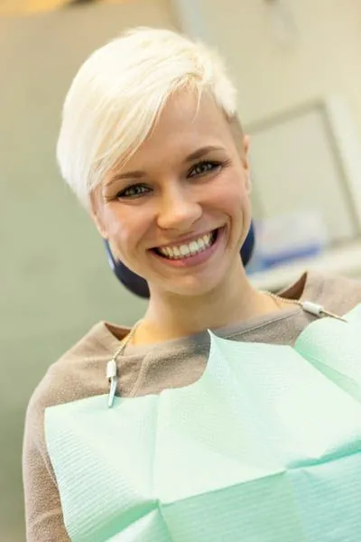 patient smiling after the Parkview Family Dentistry team helped desensitize her teeth
